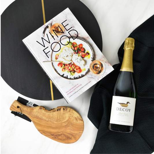 Wine Food book, Decoy wine bottle, small artisan cutting board, and black kitchen towel